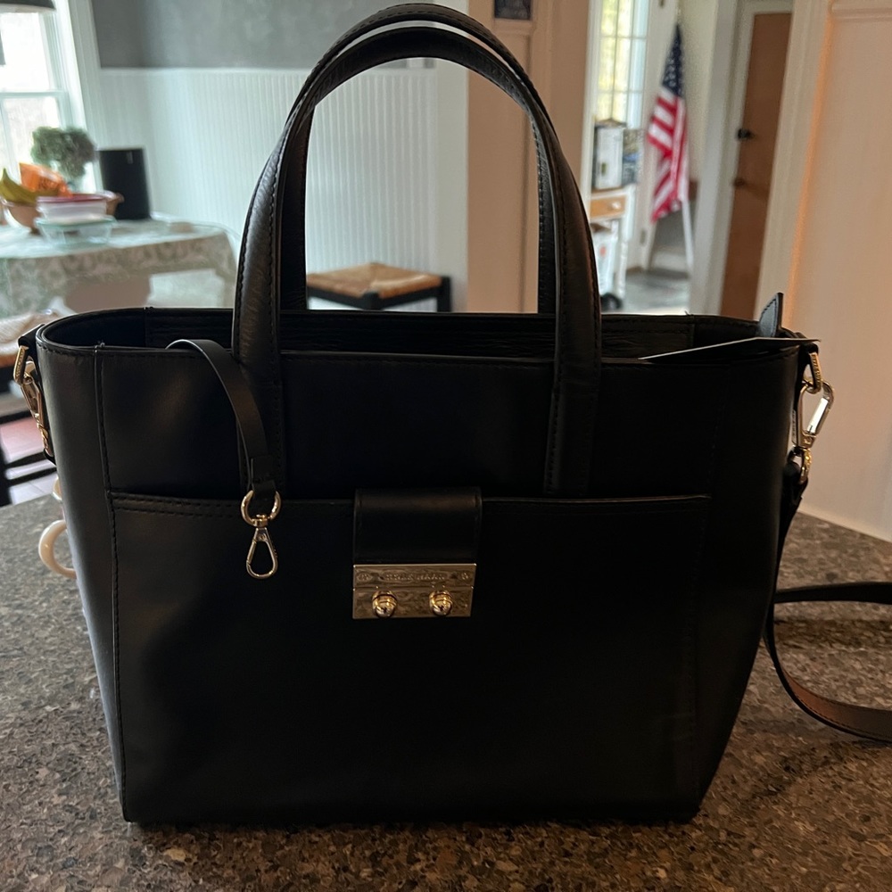 Brand new Cole Haan black bag with shoulder strap.